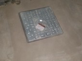 Access hatch for sump pump chamber in a basement conversion